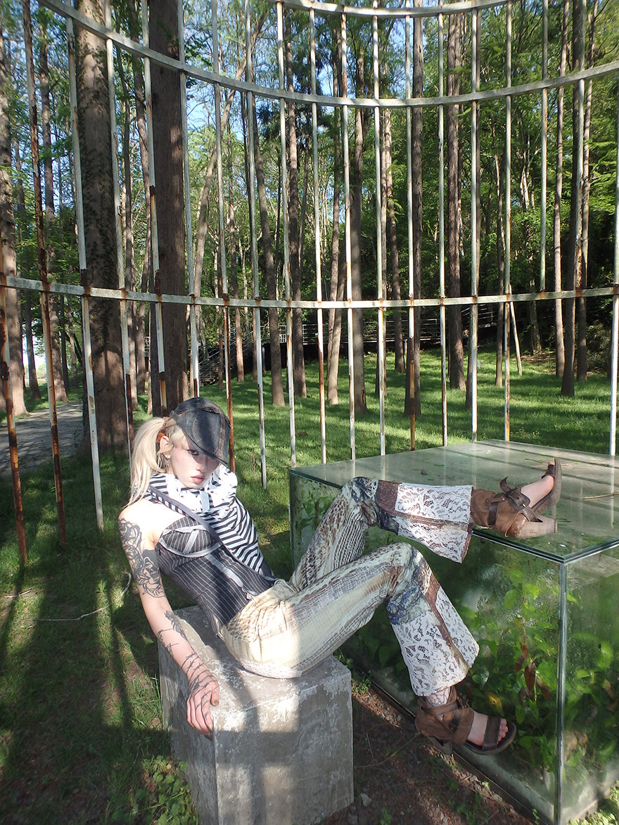 printed spider web distressed patchwork flared trousers